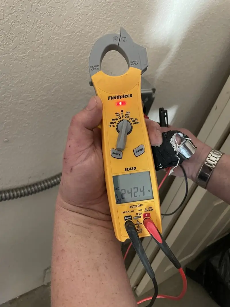 Voltage testing with clamp meter during Recessed Lighting Installation in Maynard